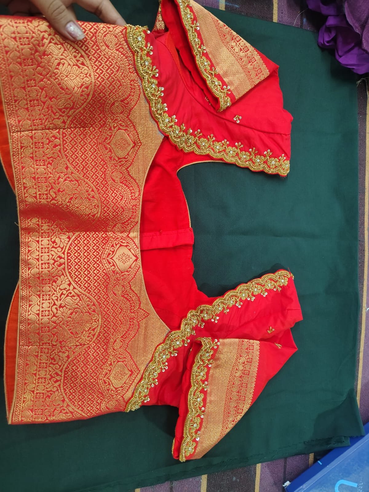 Red silk blouse with pearl and zari border