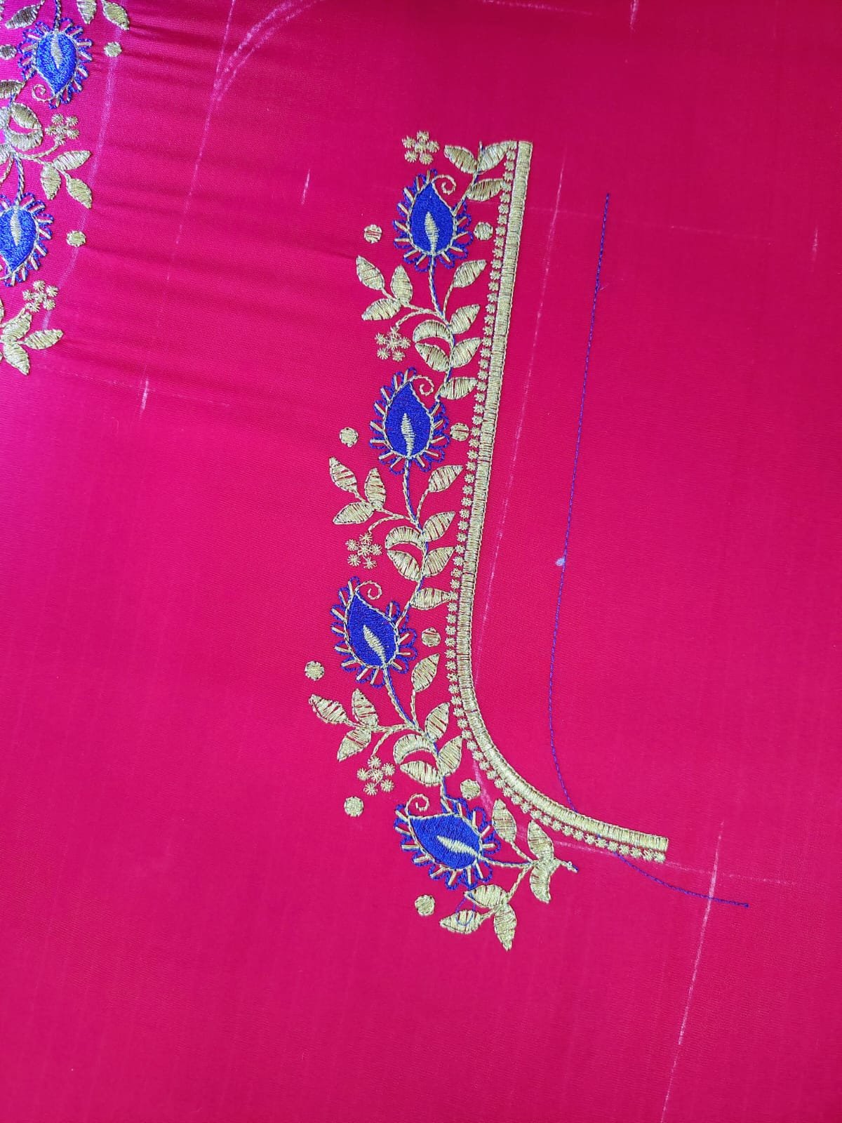 Gold vine embroidery border with blue paisley motifs