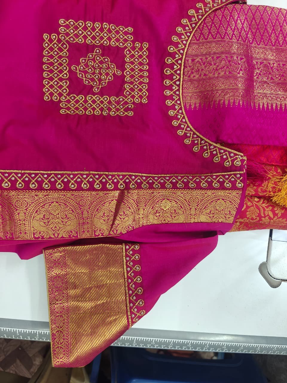 Gold lattice motif embroidery on magenta silk blouse, in progress